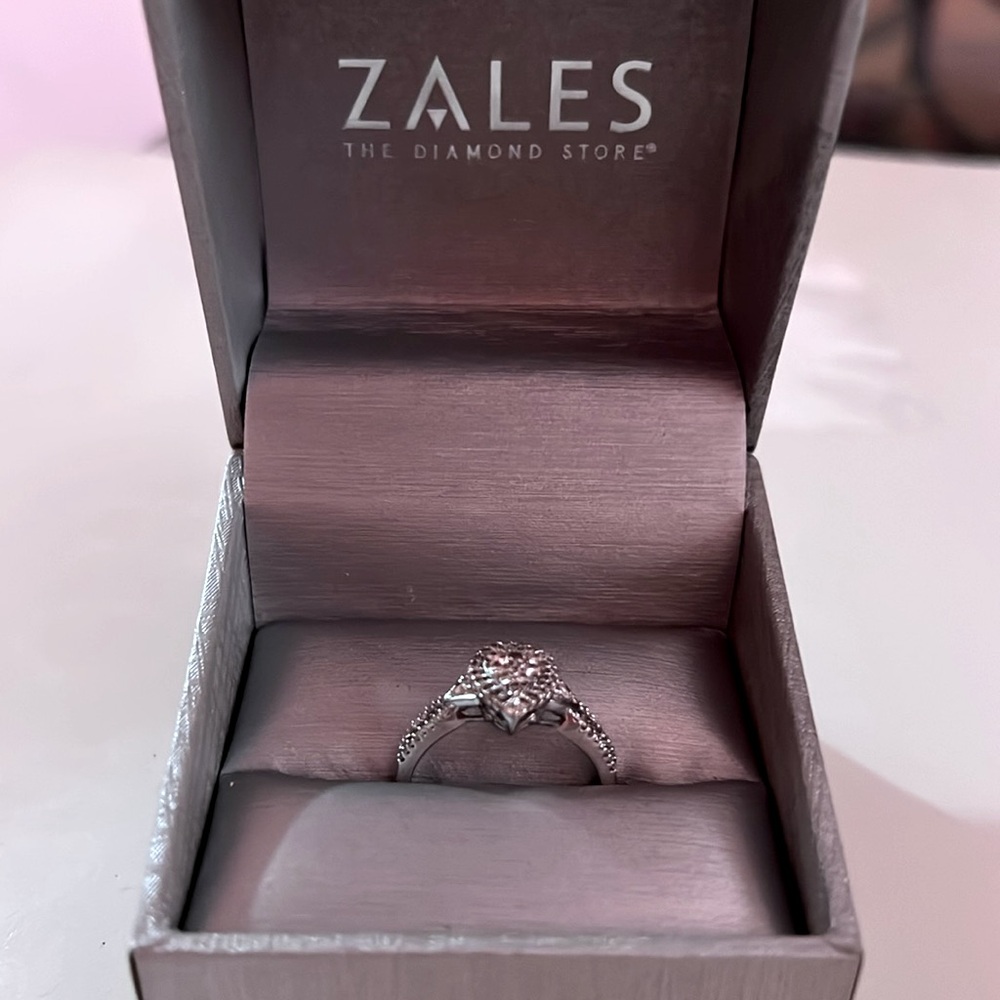 Engagement ring size 8 I bought it at Zales it is polished and clean